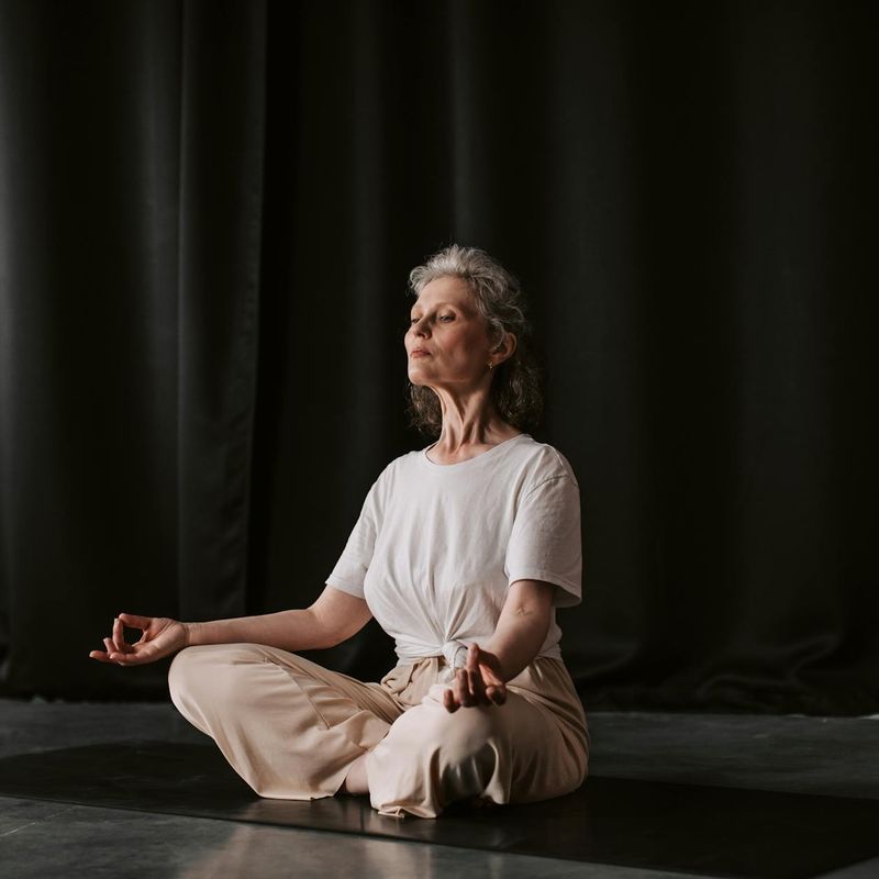 Close-up of hands in a meditative mudra position.